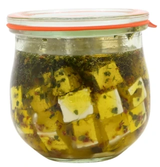 Produktfoto zu Hirtenkäse in Olivenöl mit Kräutern im Glas