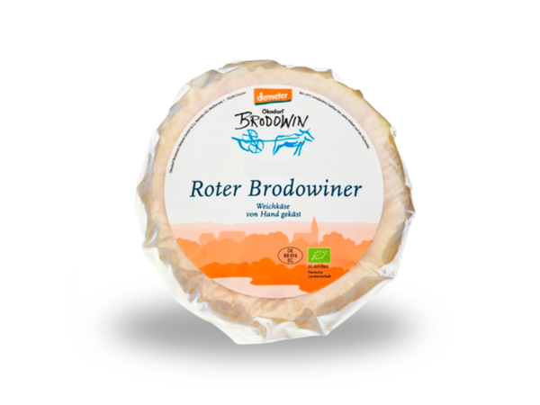KI generiert: Ein Käselaib mit der Aufschrift: "Roter Brodowiner - Weichkäse von Hand gekäst".